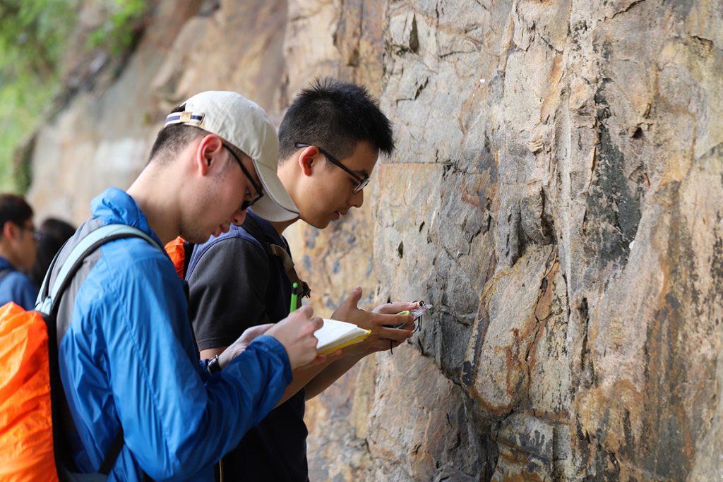 Two students looking at geological features