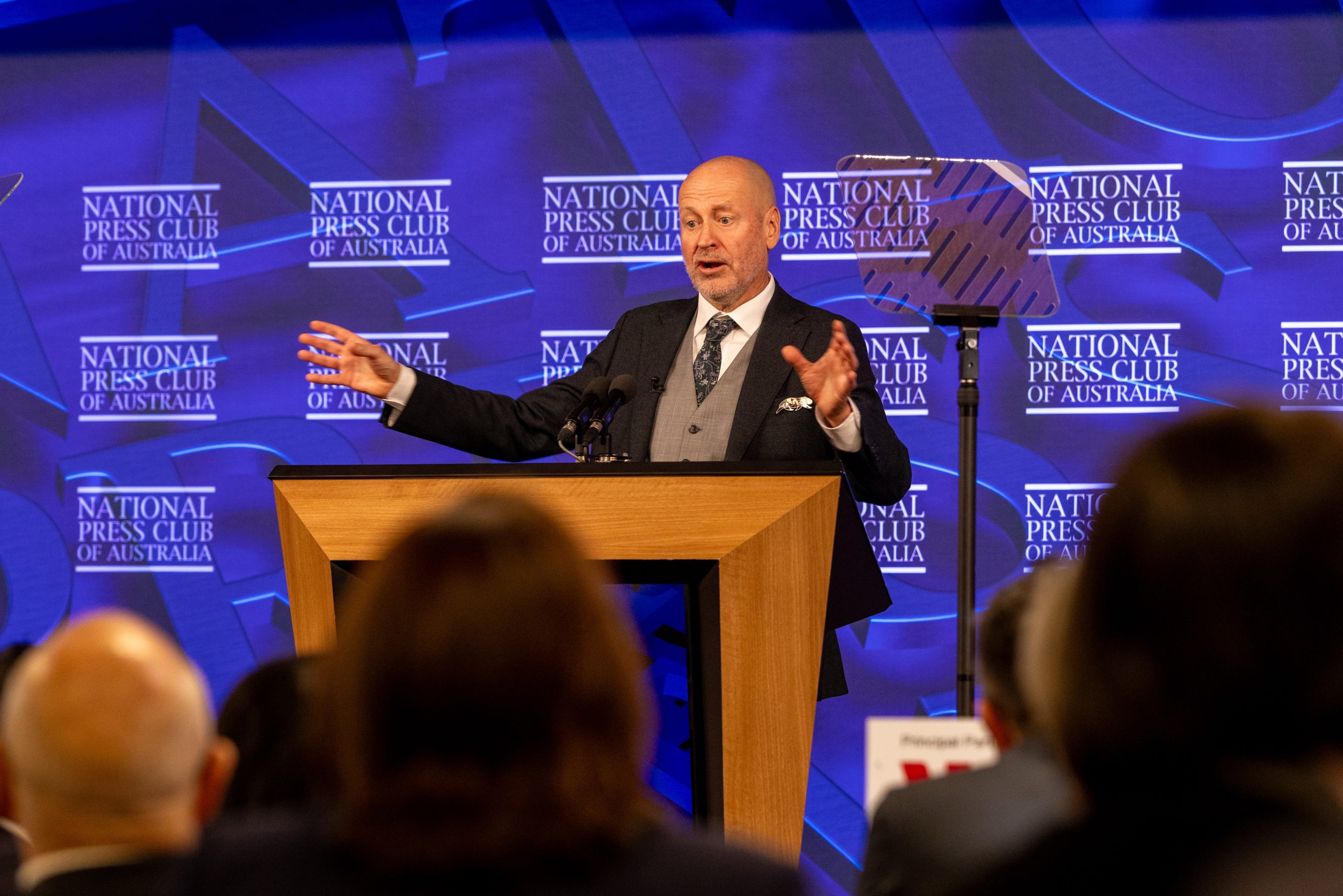 Man in suit at podium
